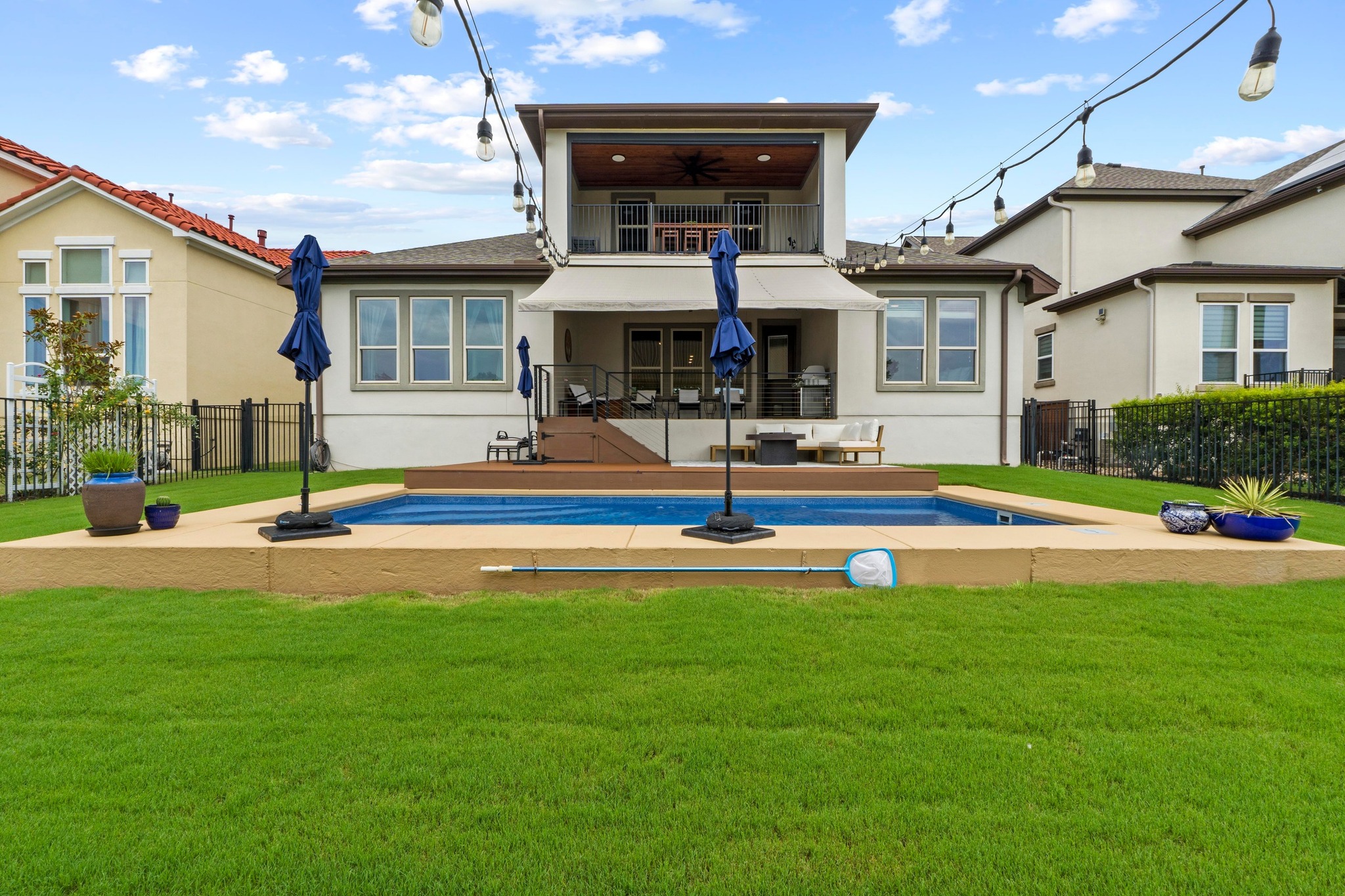 1329 Siena Sunset Road Leander, TX 78641 - Photo 29 of 33 Wild life's view of the pool from the green belt. Notice all the windows taking advantage of the view.