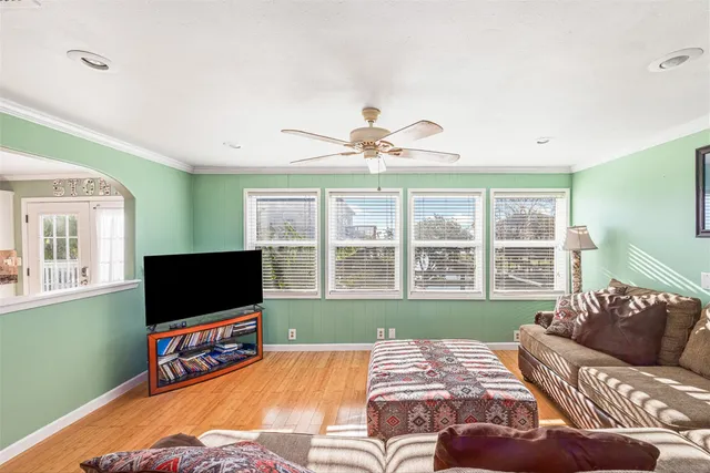 a bedroom with furniture and a flat screen tv