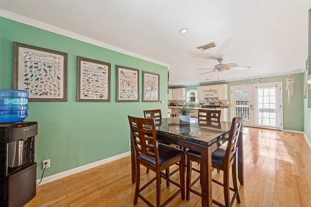a view of a dining room with furniture and window