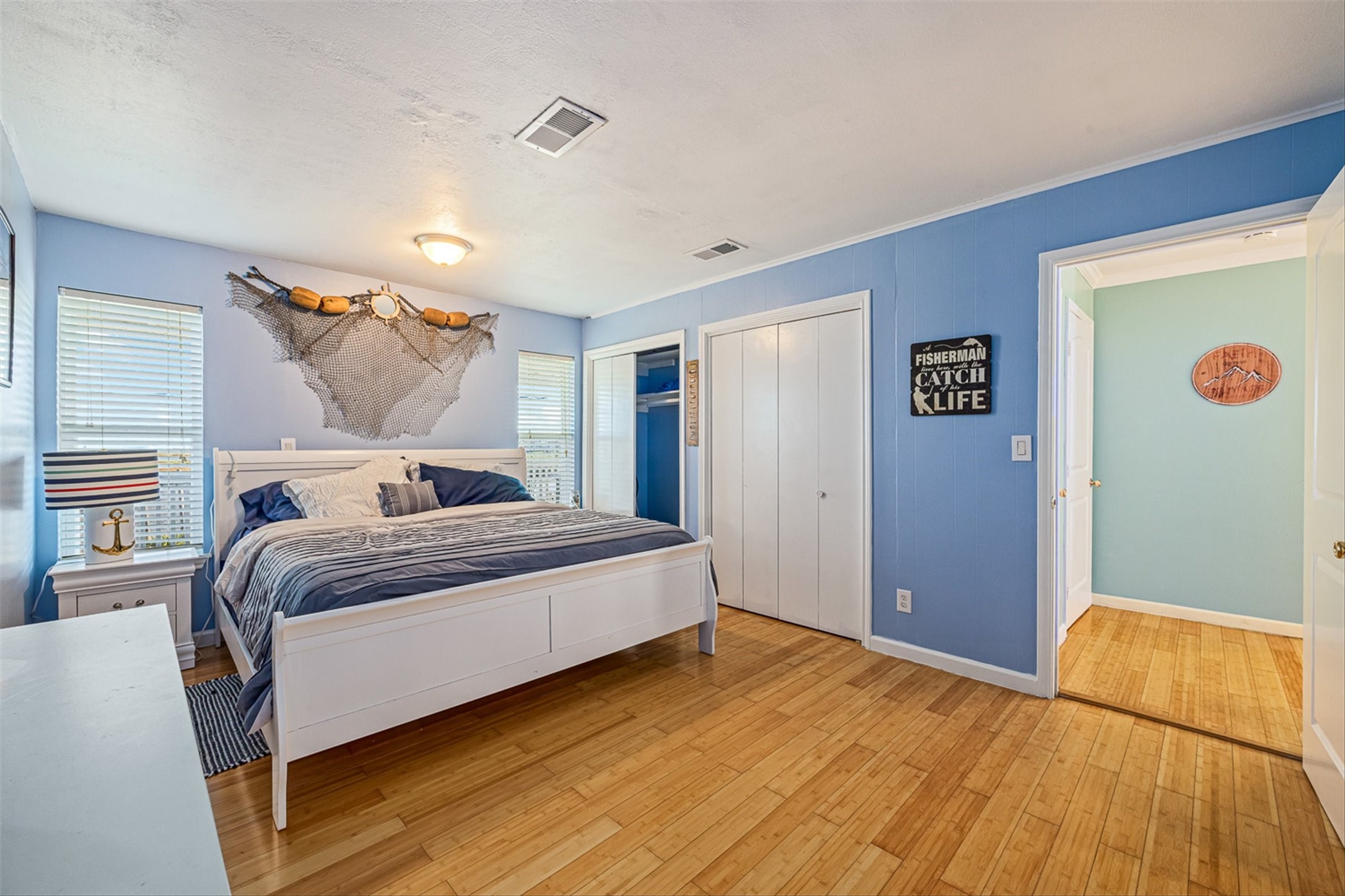 159 Garth Street Freeport, TX 77541 - Photo 32 of 42 a bedroom with a bed and a painting on the wall