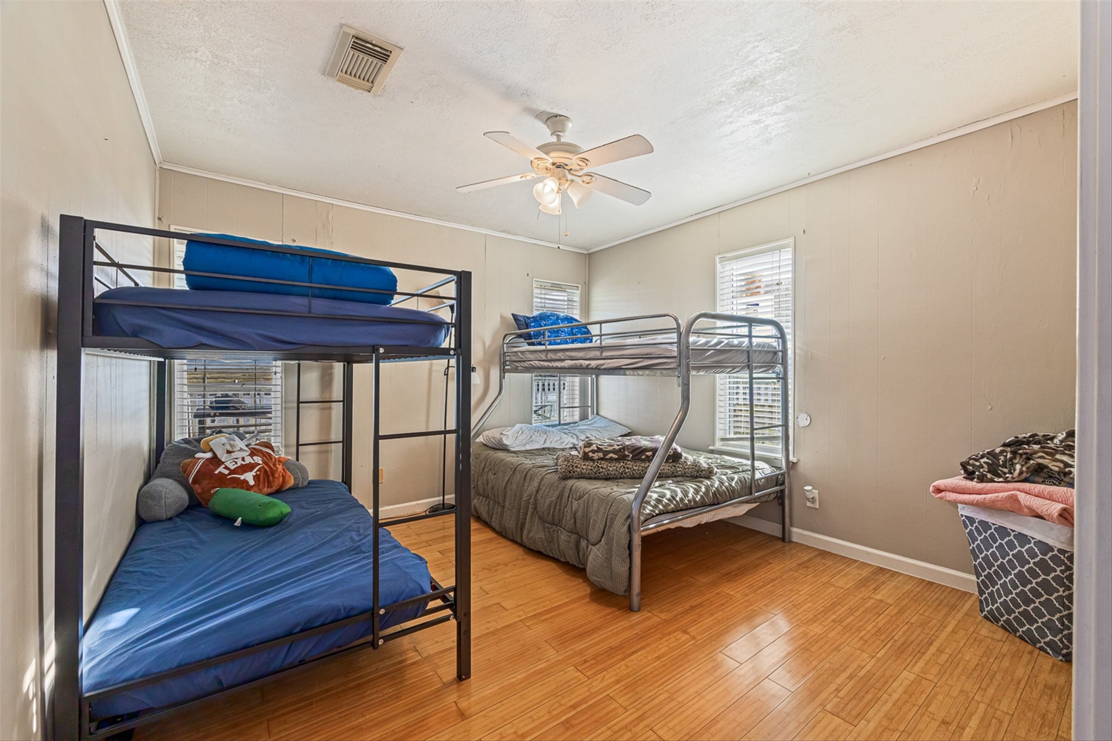 159 Garth Street Freeport, TX 77541 - Photo 37 of 42 a bedroom with furniture and wooden floor