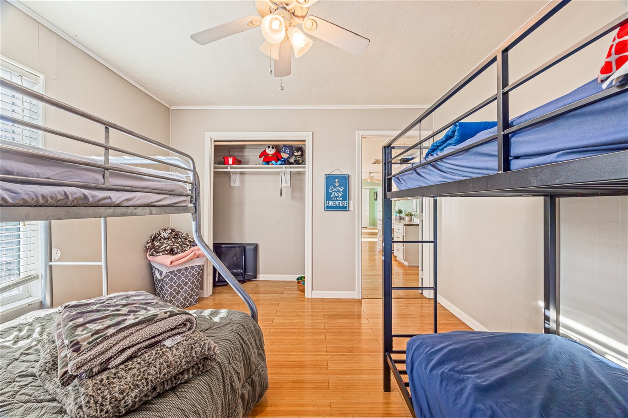 159 Garth Street Freeport, TX 77541 - Photo 39 of 42 a bedroom with a bed and a chandelier