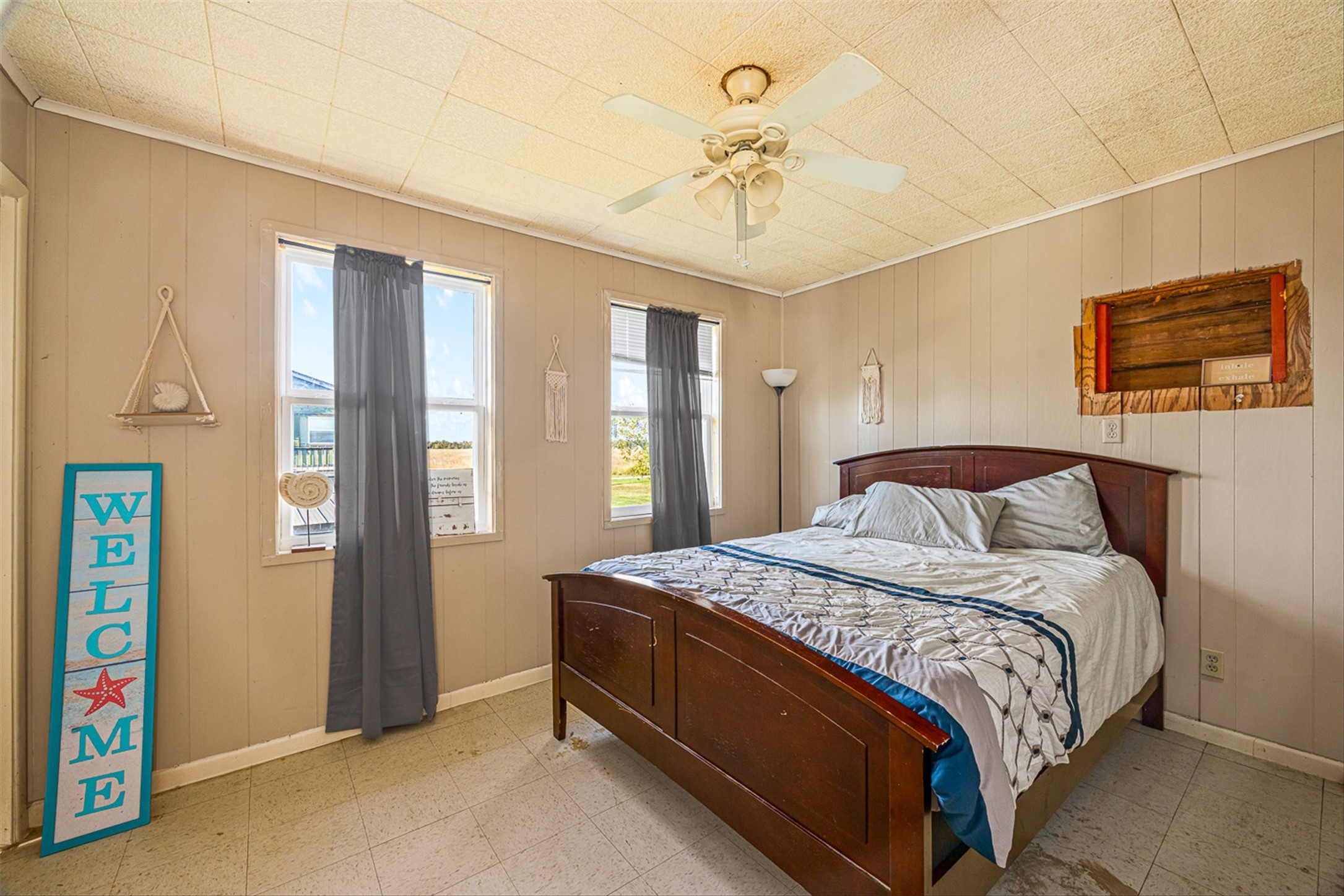 159 Garth Street Freeport, TX 77541 - Photo 40 of 42 a bedroom with a bed and a chandelier