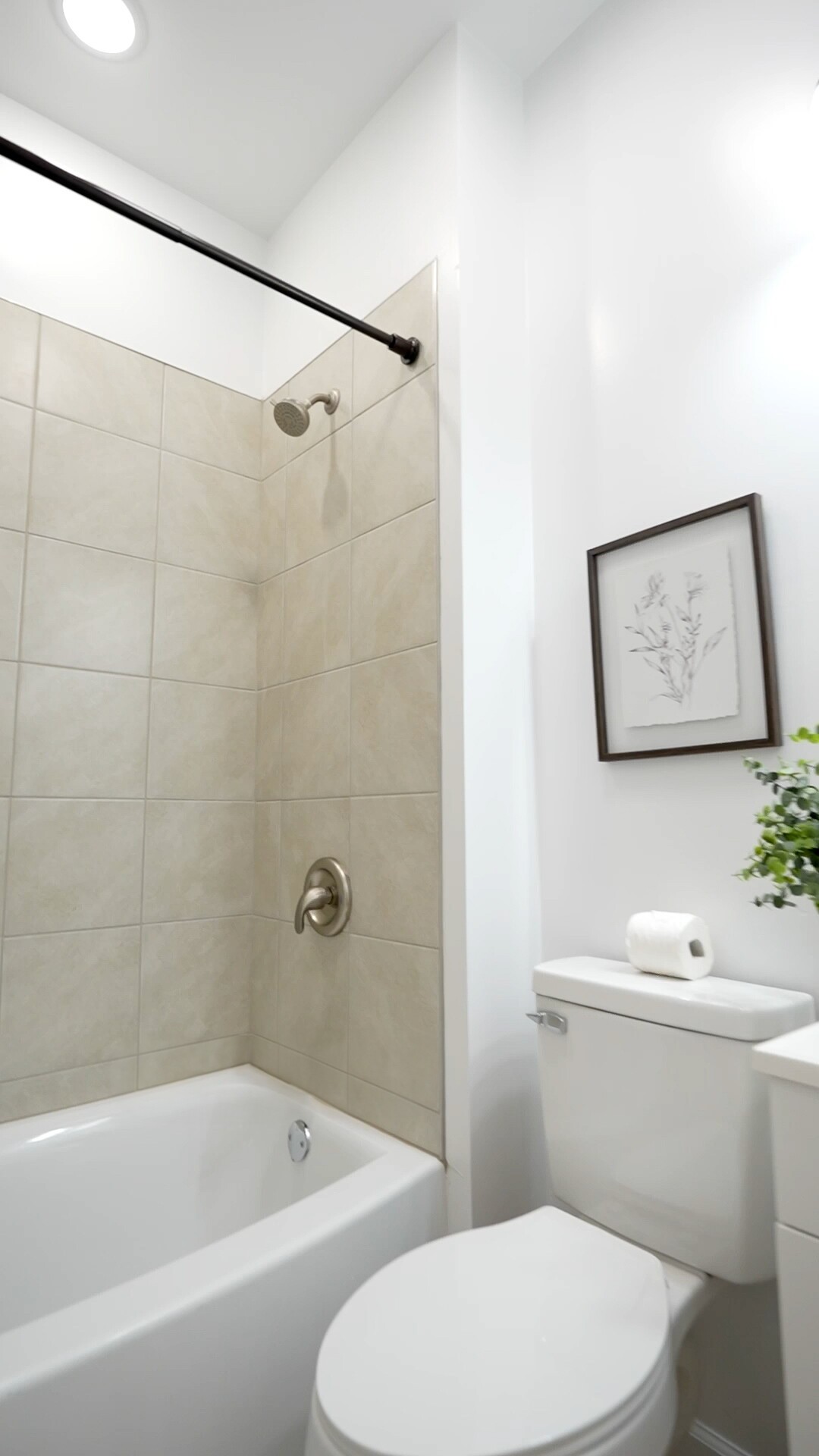 8057 Maple Street Lyles, TN 37098 - Photo 8 of 10 a white toilet sitting next to a bath tub and a shower