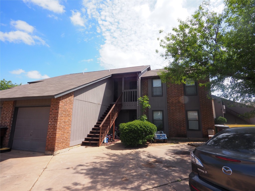 402 Rawhide Loop Round Rock, TX 78681 - Photo 1 of 17 a backyard of a house with wooden fence and large trees