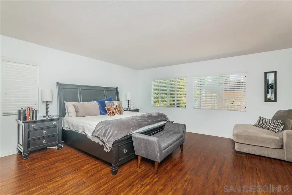 1022 Greenway Road Oceanside, CA 92057 - Photo 17 of 25 a bedroom with a bed couch and a large window