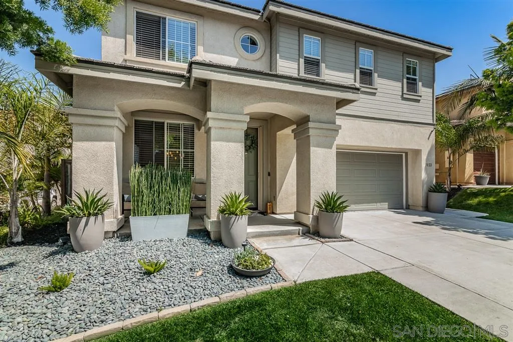 1022 Greenway Road Oceanside, CA 92057 - Photo 2 of 25 a front view of a house with garden and plants