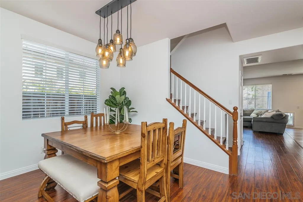 1022 Greenway Road Oceanside, CA 92057 - Photo 5 of 25 a view of a dining room with furniture and wooden floor