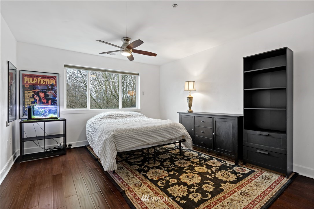 19102 20th Drive Southeast, Unit B204 Bothell, WA 98012 - Photo 13 of 30 a bedroom with a bed and a window