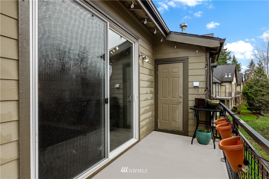 19102 20th Drive Southeast, Unit B204 Bothell, WA 98012 - Photo 23 of 30 a yellow room with wooden floor and windows