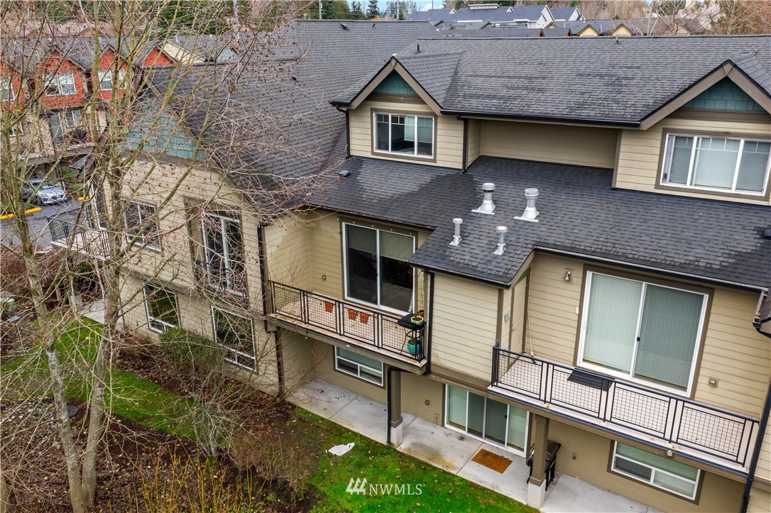 19102 20th Drive Southeast, Unit B204 Bothell, WA 98012 - Photo 28 of 30 a front view of a house with a yard