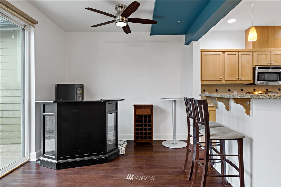 19102 20th Drive Southeast, Unit B204 Bothell, WA 98012 - Photo 6 of 30 a view of kitchen with furniture and wooden floor