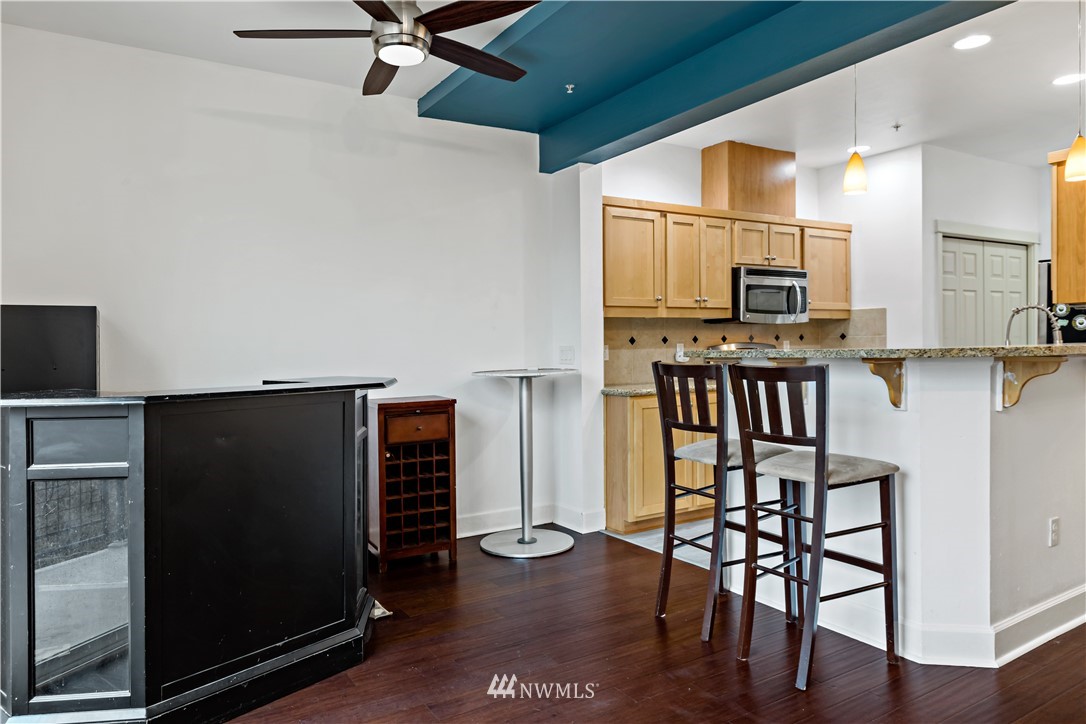 19102 20th Drive Southeast, Unit B204 Bothell, WA 98012 - Photo 7 of 30 a view of kitchen with furniture and wooden floor