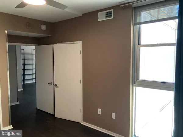a view of walk in closet with window