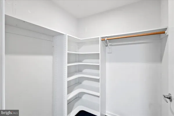 a view of an empty walk in closet