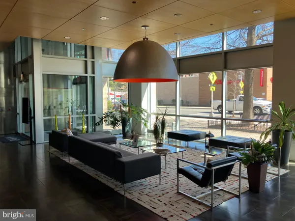 a outdoor living space with furniture and a flat screen tv