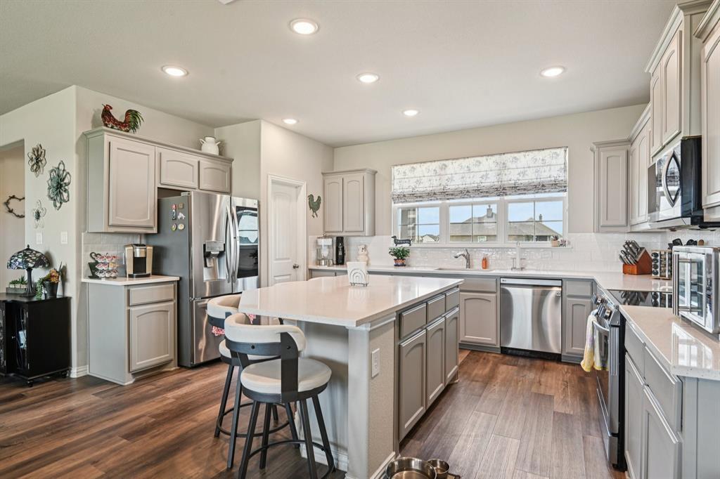 2505 Southern Oak Trail Terrell, TX 75161 - Photo 14 of 38 The kitchen boast an extra large Island with storage and electric outlets.