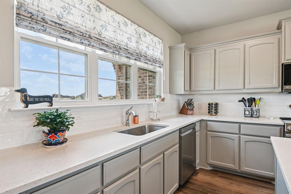 2505 Southern Oak Trail Terrell, TX 75161 - Photo 16 of 38 Large stainless steel farmhouse sink with amazing large front windows.