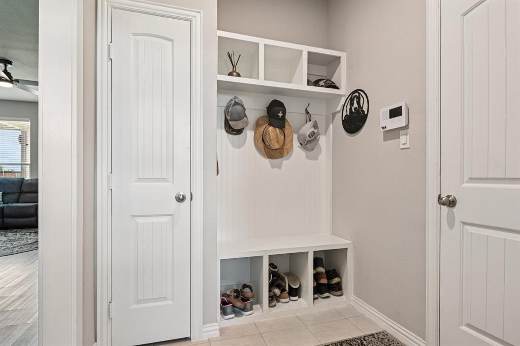 2505 Southern Oak Trail Terrell, TX 75161 - Photo 18 of 38 Very convenient mudroom next to the garage entrance with a bench and storage