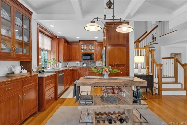 a large kitchen with a table and chairs