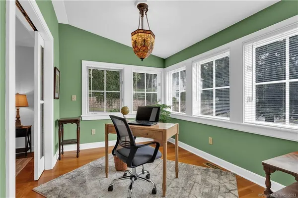 a view of a dining room with furniture window and outside view