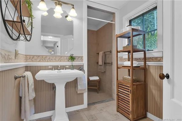 a bathroom with a sink and mirror