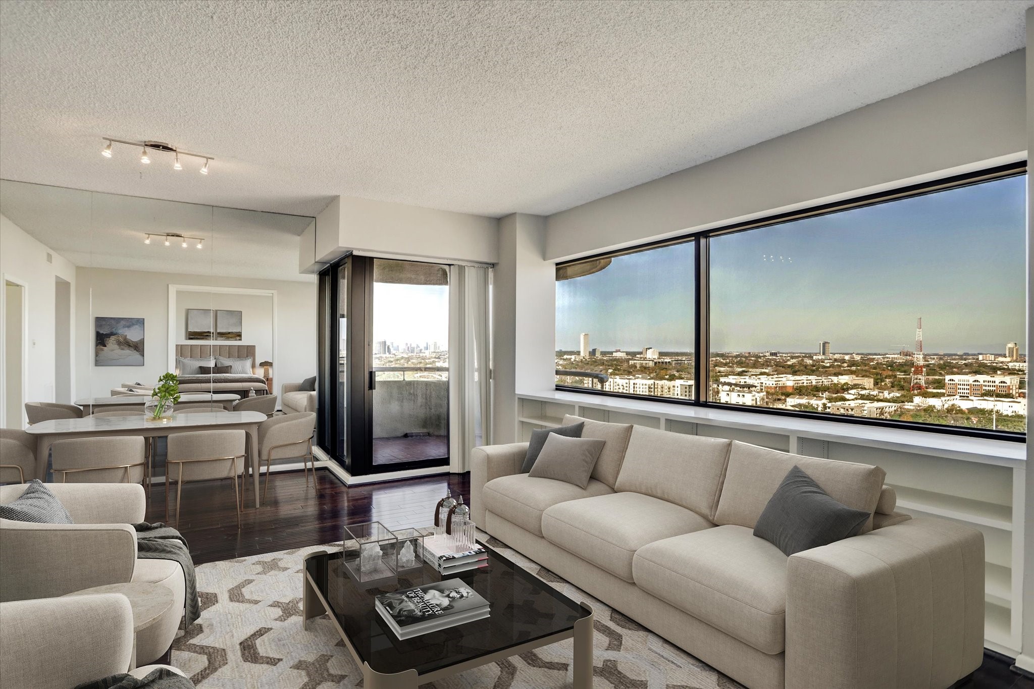a living room with furniture and a floor to ceiling window