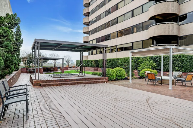 a view of a swimming pool with a patio