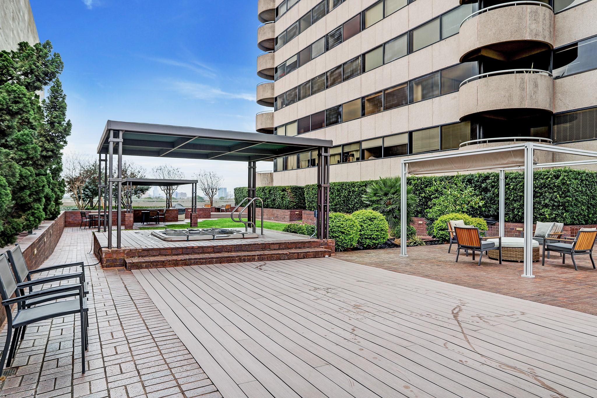 5000 Montrose Boulevard, Unit 18A Houston, TX 77006 - Photo 11 of 14 a view of a swimming pool with a patio