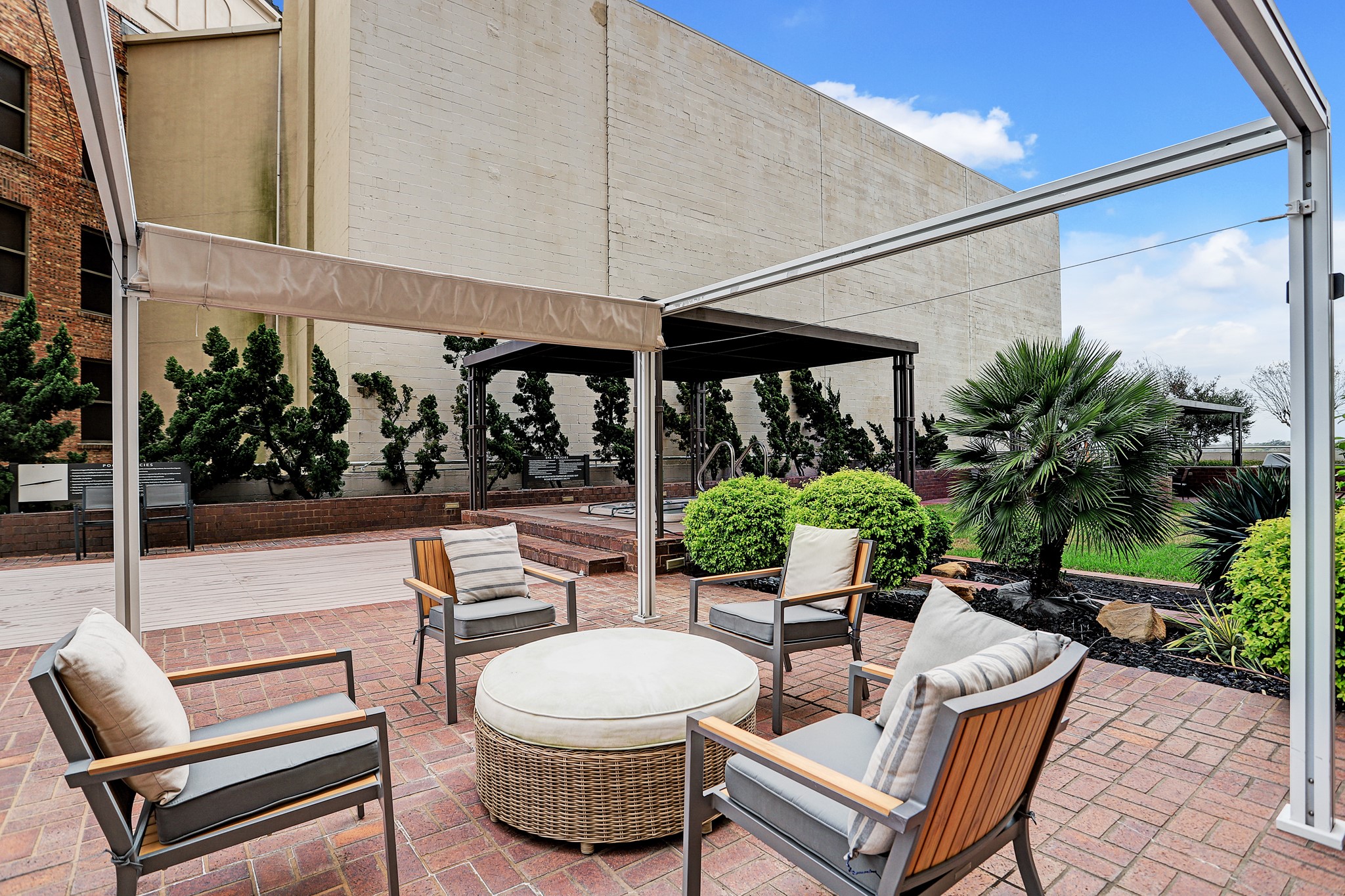 5000 Montrose Boulevard, Unit 18A Houston, TX 77006 - Photo 14 of 14 a view of a patio with a dining table and chairs potted plants