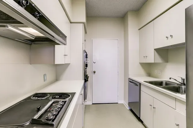 a kitchen with a stove and a refrigerator