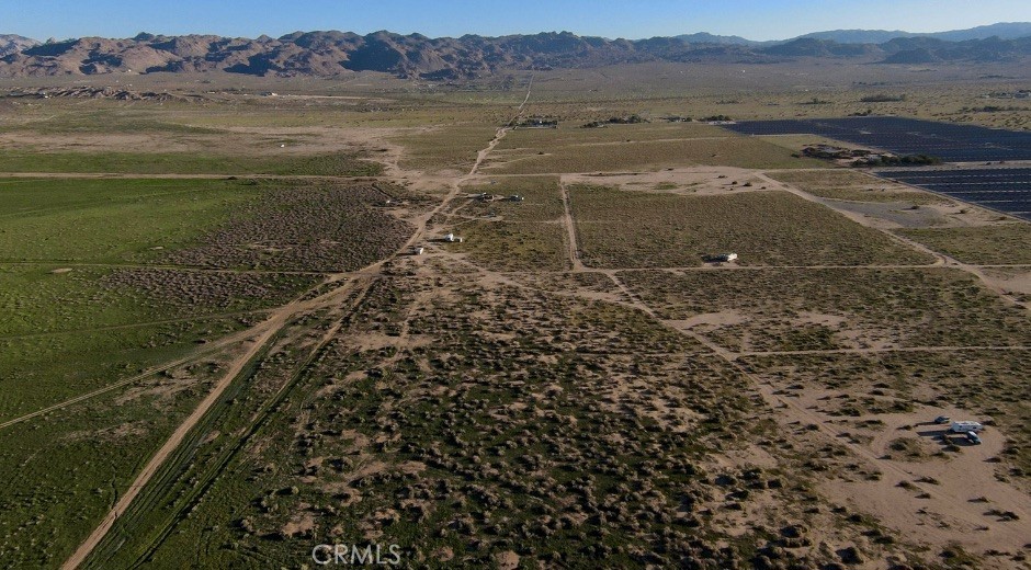 65650 Sun Mesa Road Joshua Tree, CA 92252 - Photo 2 of 11 a view of a lake with a mountain