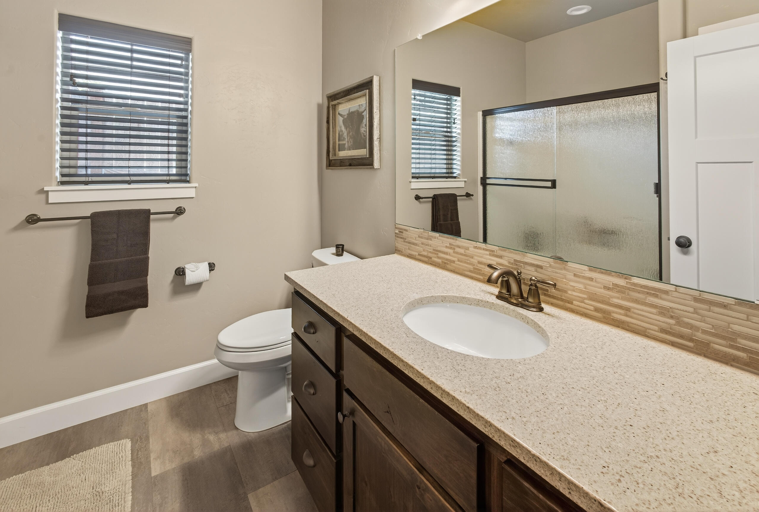 2793 Southwest 33rd Street Redmond, OR 97756 - Photo 24 of 44 a bathroom with a granite countertop sink toilet and mirror