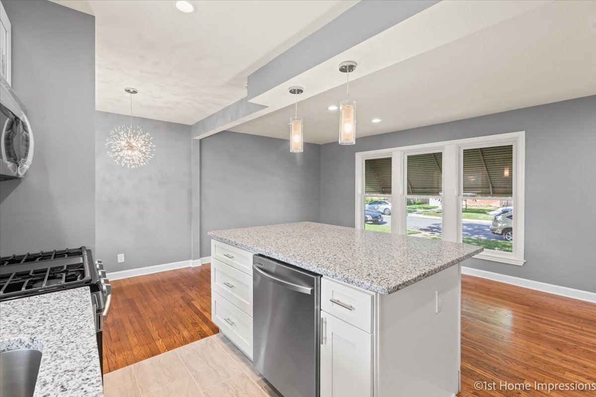 10005 South Sangamon Street Chicago, IL 60643 - Photo 13 of 30 a kitchen with granite countertop a stove and a sink