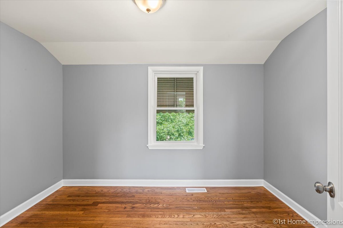 10005 South Sangamon Street Chicago, IL 60643 - Photo 14 of 30 a view of a room with wooden floor and window
