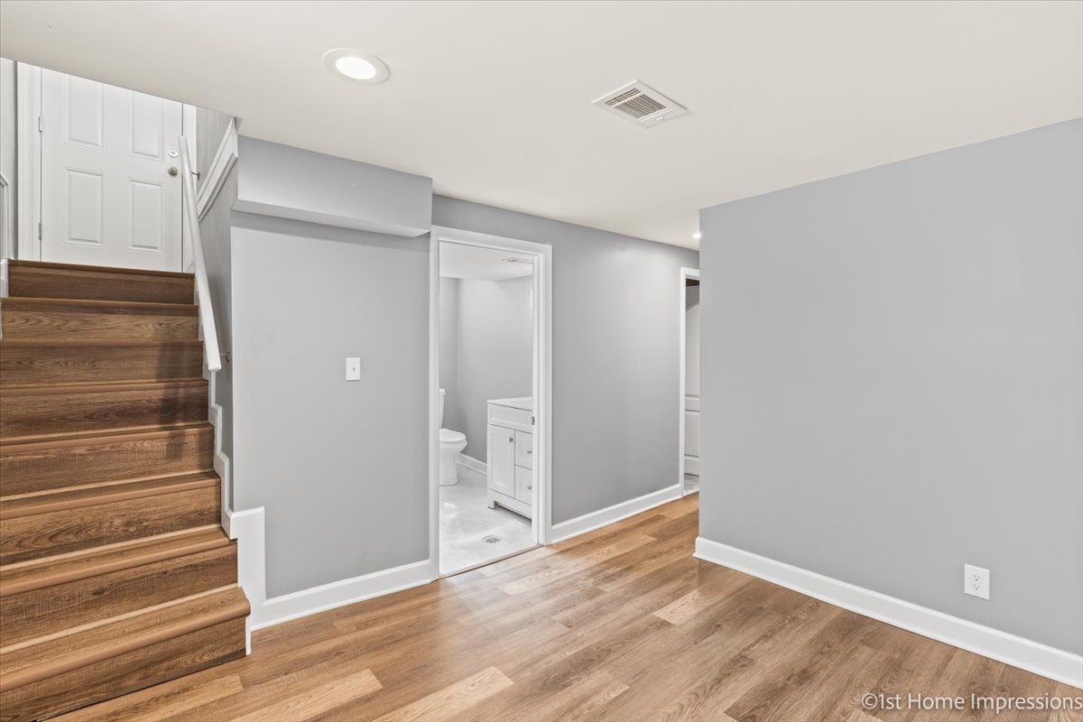 10005 South Sangamon Street Chicago, IL 60643 - Photo 18 of 30 a view of an empty room with wooden floor and a window