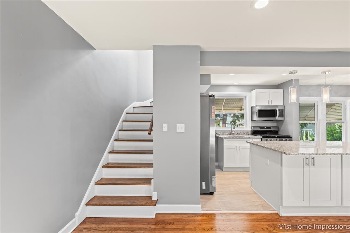 10005 South Sangamon Street Chicago, IL 60643 - Photo 3 of 30 a view of a kitchen with wooden floor and electronic appliances