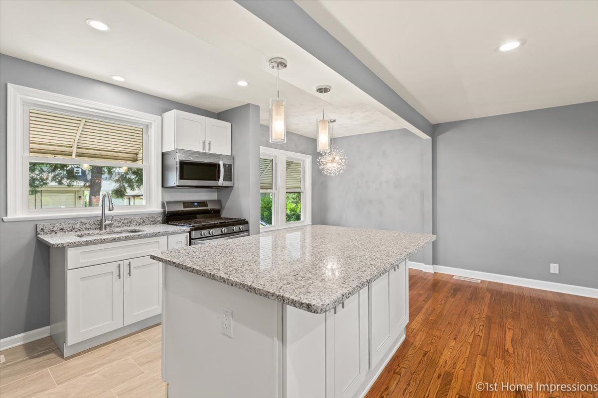 10005 South Sangamon Street Chicago, IL 60643 - Photo 6 of 30 a kitchen with sink a microwave and cabinets
