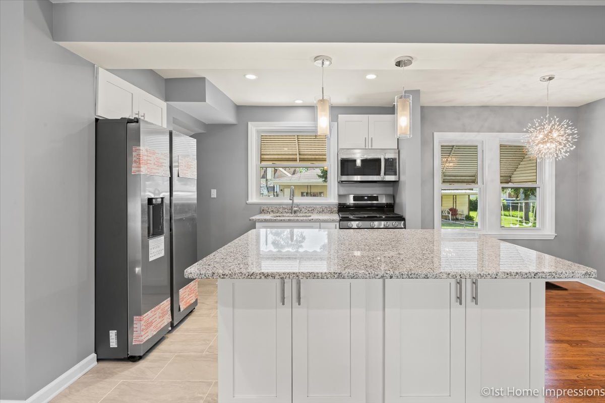 10005 South Sangamon Street Chicago, IL 60643 - Photo 7 of 30 a kitchen with stainless steel appliances granite countertop a refrigerator and a stove