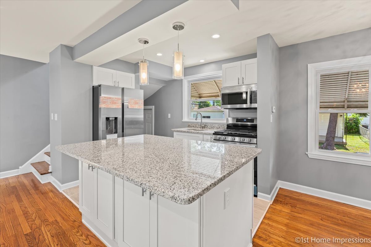 10005 South Sangamon Street Chicago, IL 60643 - Photo 10 of 30 a kitchen with stainless steel appliances granite countertop a sink stove and refrigerator
