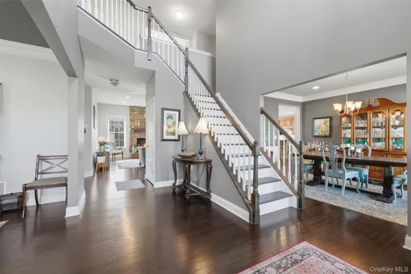 a view of entryway livingroom and hall with wooden floor