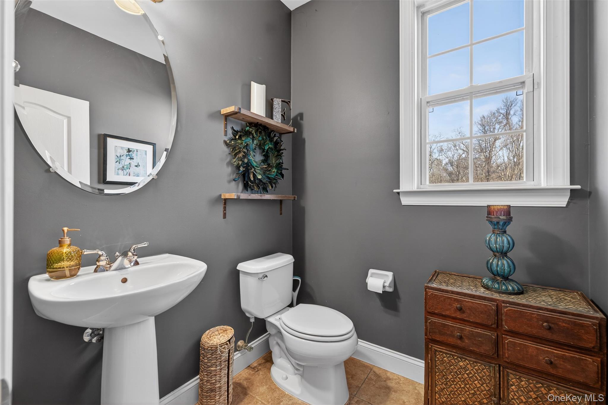 102 Luthien Forrest Road Rock Tavern, NY 12575 - Photo 19 of 45 a bathroom with a toilet sink and mirror