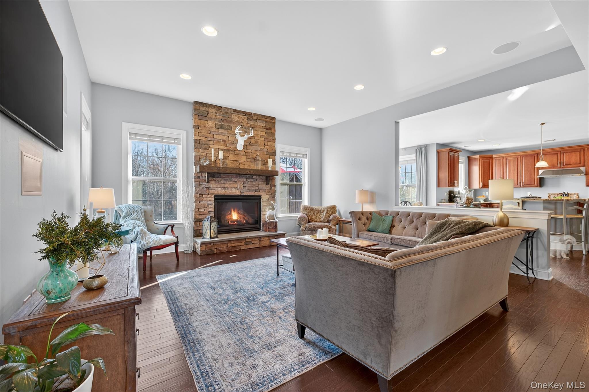102 Luthien Forrest Road Rock Tavern, NY 12575 - Photo 20 of 45 a living room with furniture a fireplace and a flat screen tv