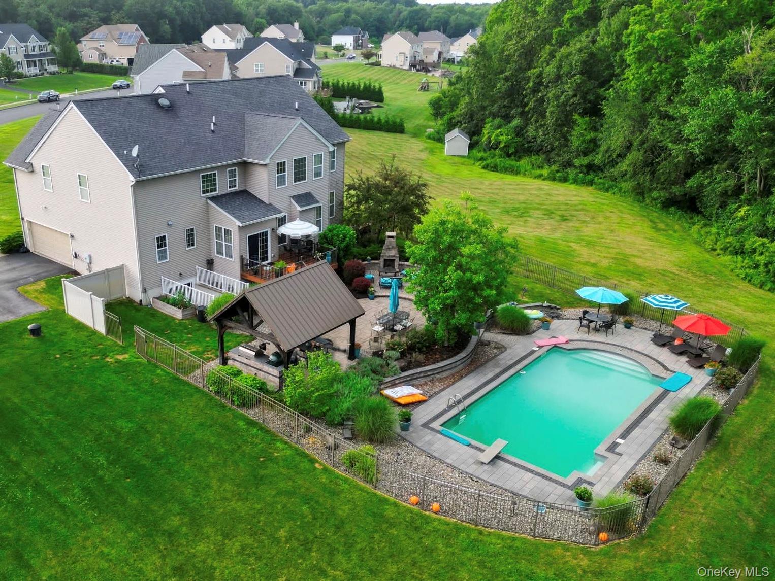 102 Luthien Forrest Road Rock Tavern, NY 12575 - Photo 2 of 6 Aerial perspective of suburban area with a pool