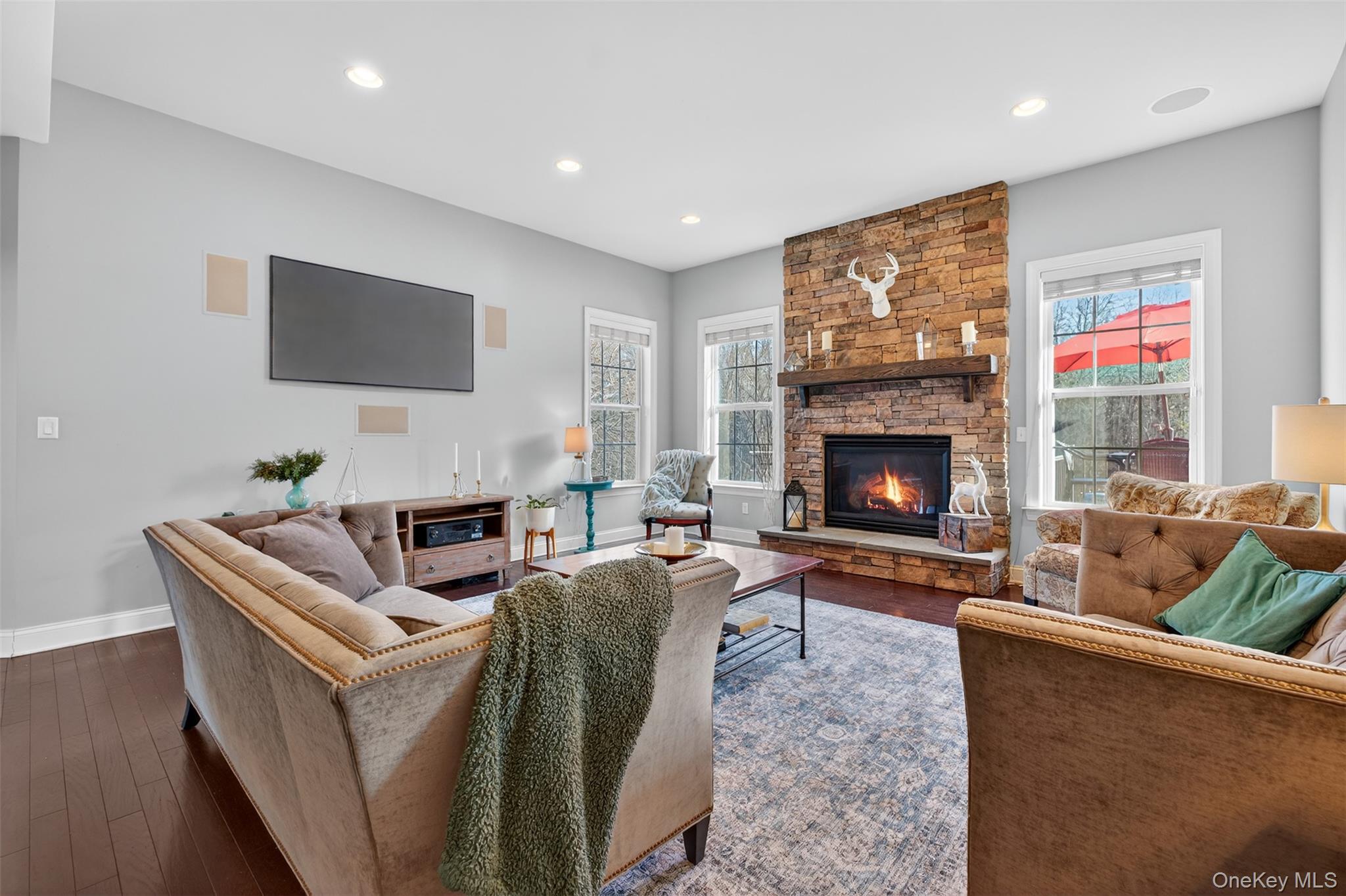 102 Luthien Forrest Road Rock Tavern, NY 12575 - Photo 21 of 45 a living room with furniture a fireplace and a flat screen tv