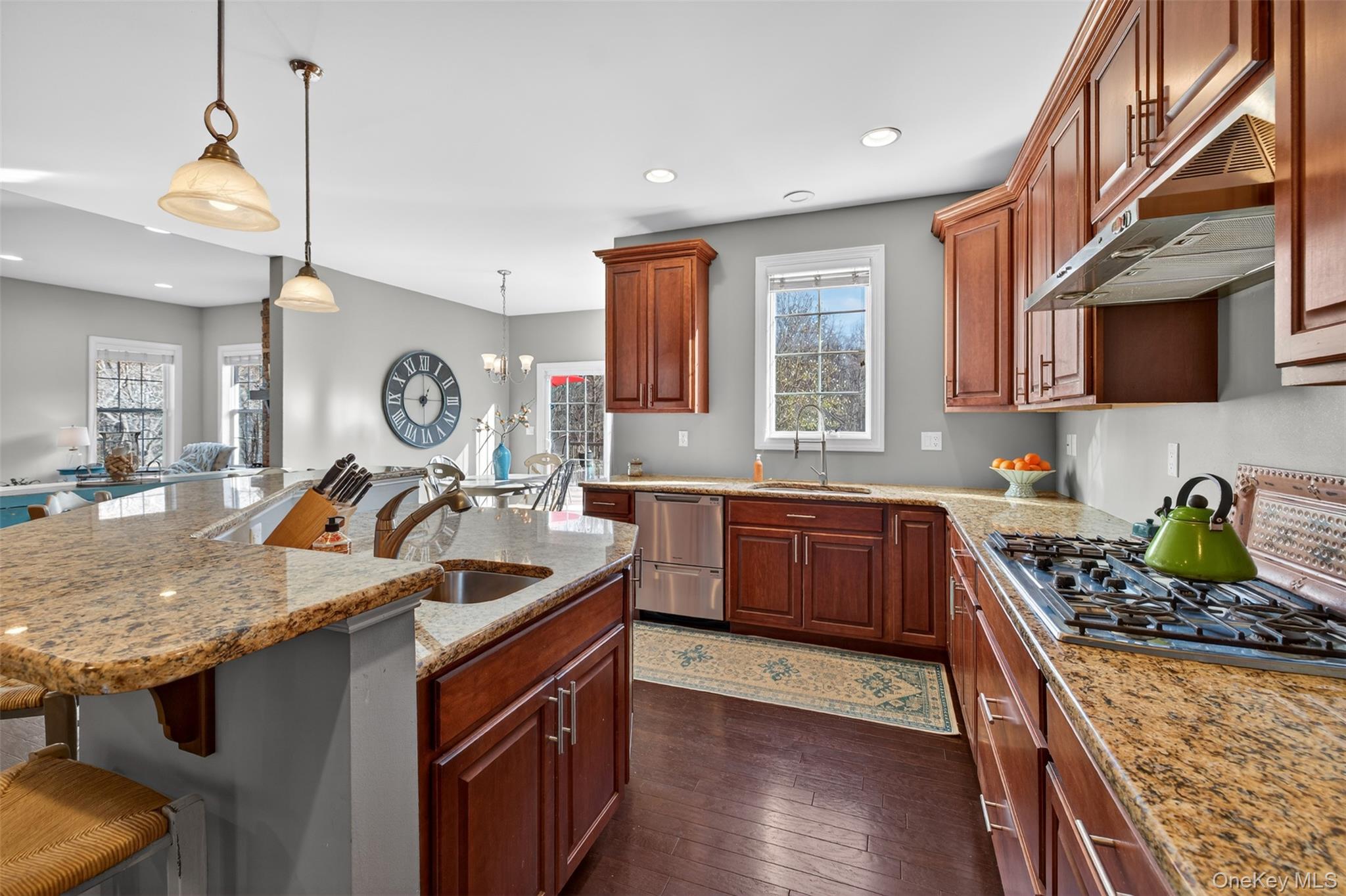 102 Luthien Forrest Road Rock Tavern, NY 12575 - Photo 27 of 45 a kitchen with a stove a sink a refrigerator and wooden cabinets