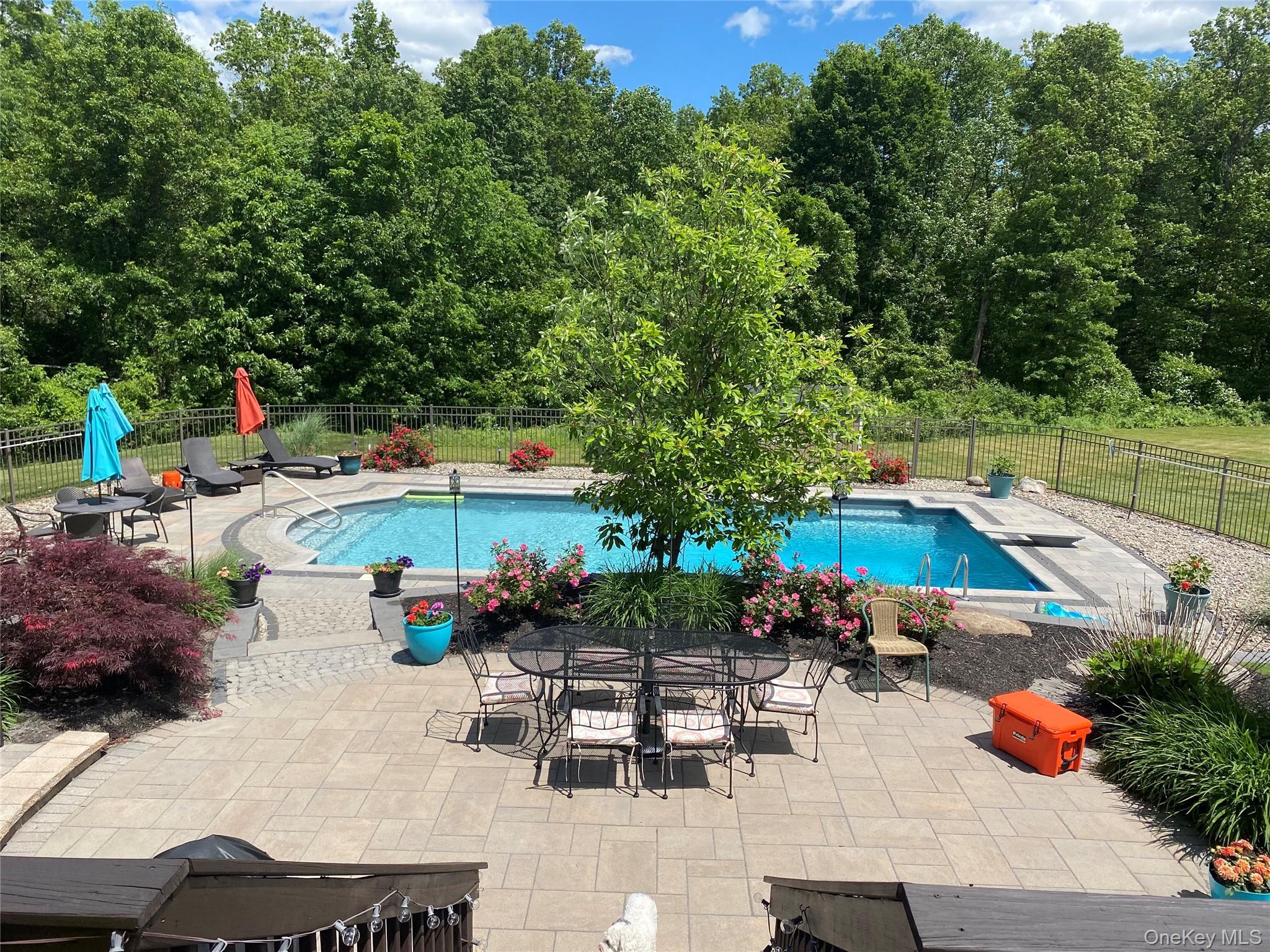 102 Luthien Forrest Road Rock Tavern, NY 12575 - Photo 3 of 45 an outdoor space with patio furniture and potted plants
