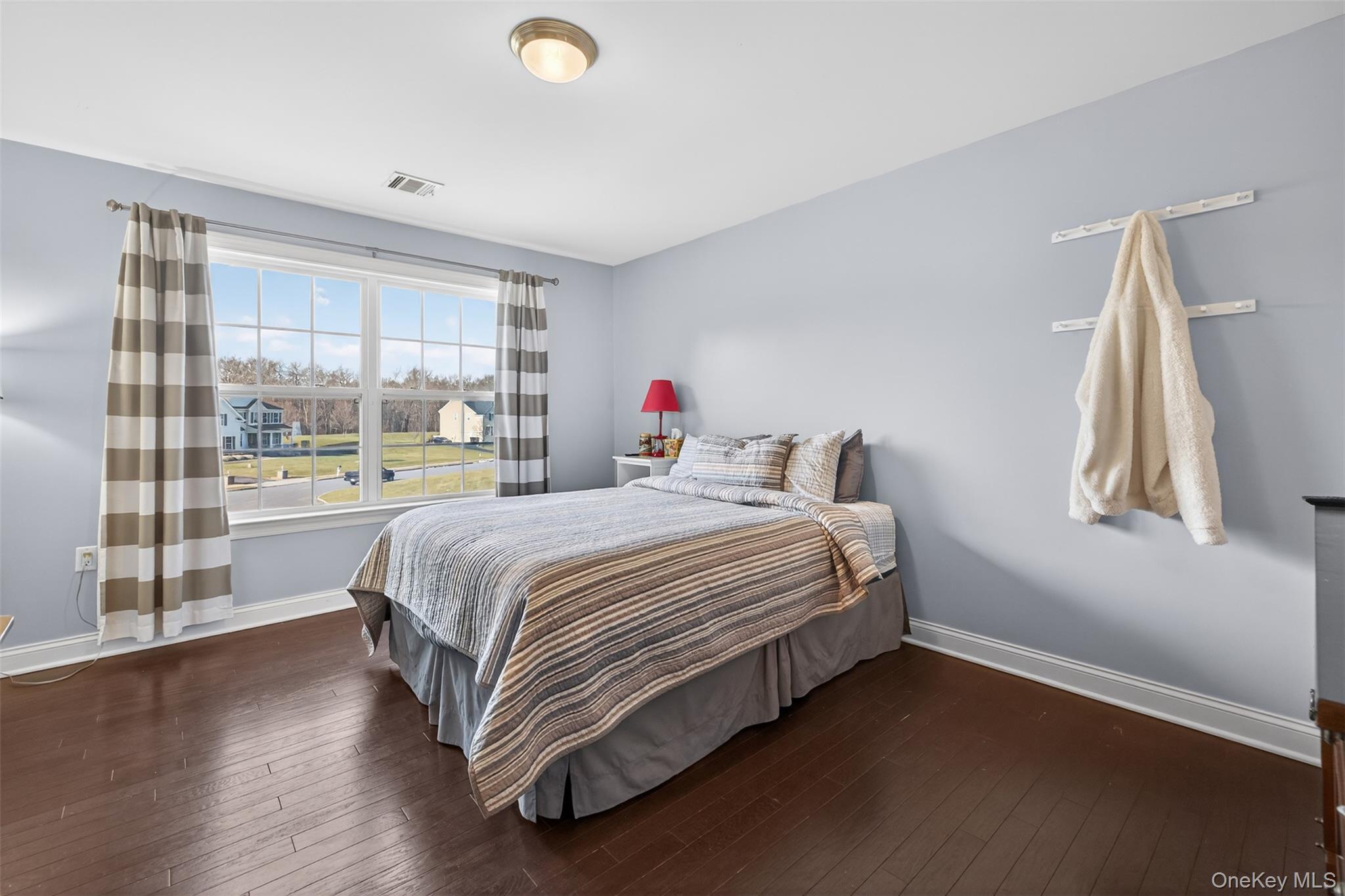 102 Luthien Forrest Road Rock Tavern, NY 12575 - Photo 35 of 45 a bedroom with a bed and a large window
