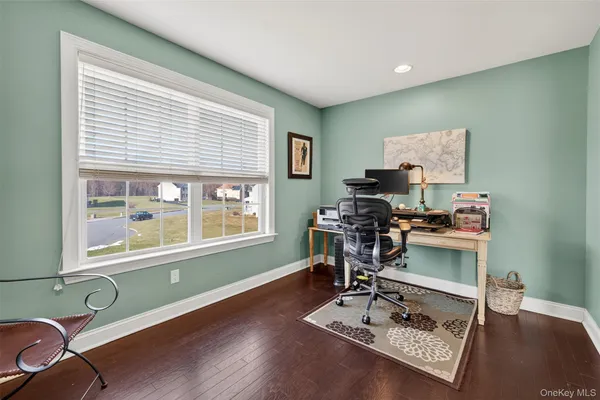 a workspace with furniture and a window