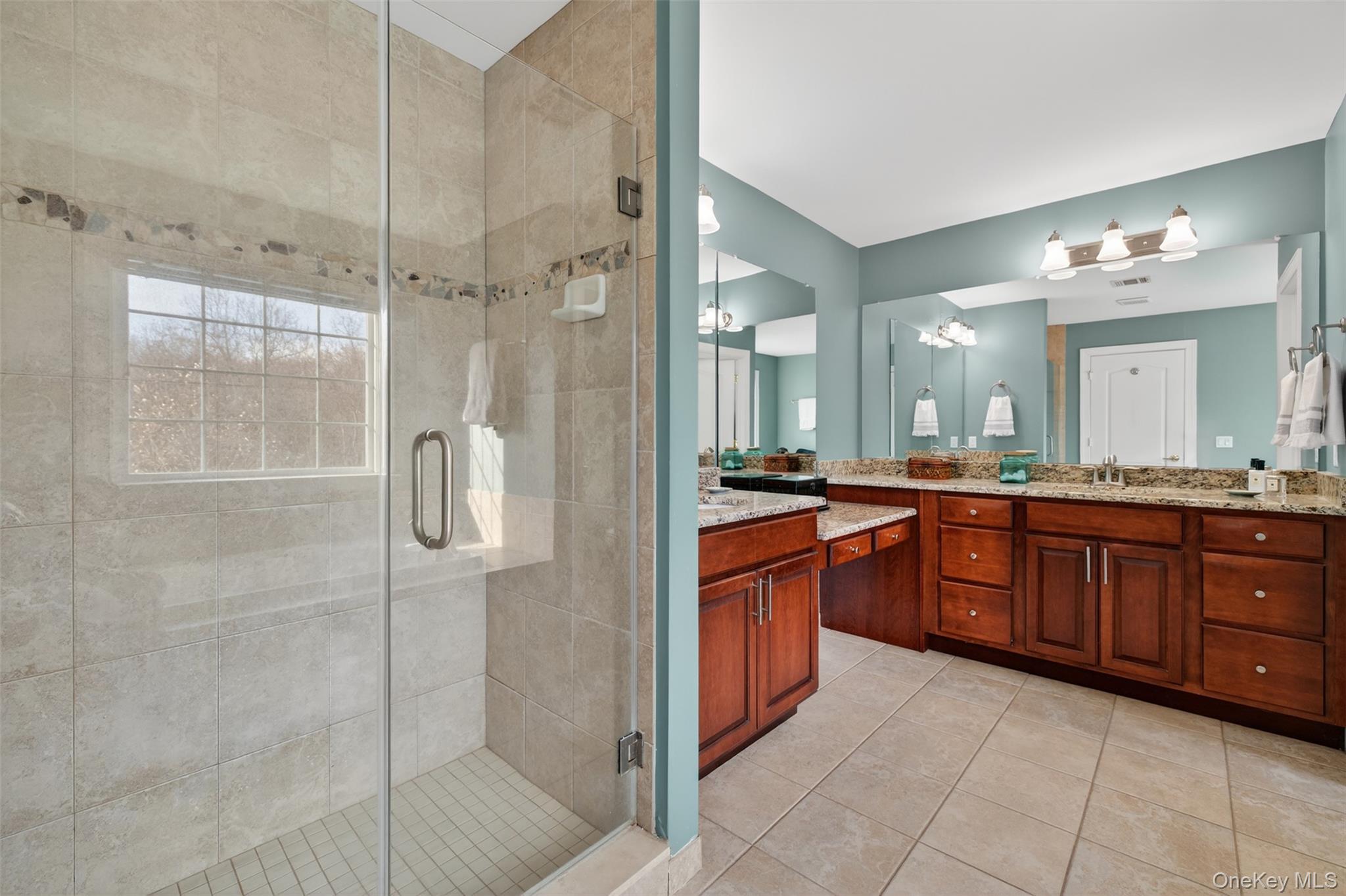 102 Luthien Forrest Road Rock Tavern, NY 12575 - Photo 41 of 45 a large bathroom with a granite countertop double vanity sink mirror and shower